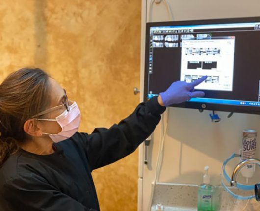Dentist explaining Report to Patient